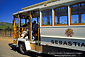 Sebastiani Tour Bus next to vineyard in the Sonoma Valley, California