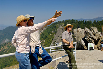 Tourists pointing and Park Ranger on top of Moro Rock, Sequoia National Park, California; Stock Photo photography picture image photograph fine art decor print wall mural gallery