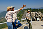 Tourists pointing and Park Ranger on top of Moro Rock, Sequoia National Park, California