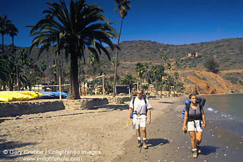 Picture: Couple backpacking returns to sandy beach at Two Harbors, Catalina Island, California