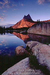 Alpenglow at sunset on Cathedral Peak and mountain lake, Tioga Pass Region, High Sierra, Yosemite National Park, California