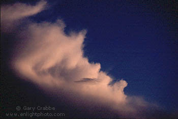 Sunset light on the trailing edge of a cumulonimbus thundercloud after a rainstorm, Ogden, Utah