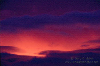 Red light in storm clouds at sunset