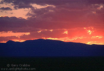 Red sky at sunset through storm clouds, Colorado