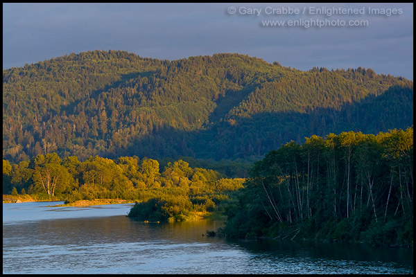 Photo: Sunset light on forested hills and trees along the Klamath River, Del Norte County, California