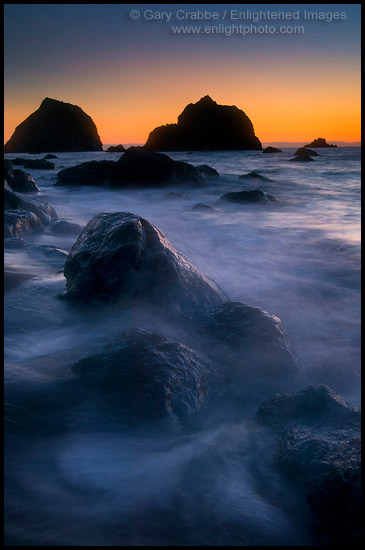 Photo: Sunset light over seastacks and coastal rocks on beach at False Klamath Cove, Redwood National Park, California