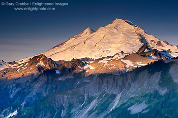 Sunrise light on the snow covered glacier of Mount Baker volcano, Mount Baker National Recreation Area, Cascade Mountain Range, Washington