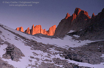 Alpenglow at sunrise on rock spires near Mount Whitney, Eastern Sierra, California