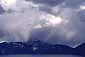 Rain and sunlight in a fall storm over Crater Lake, Crater Lake National Park, Oregon