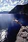 Taking the Plunge. Diving into the clear blue waters of Crater Lake, Crater Lake National Park, Oregon