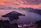 Red sky and storm clouds at sunset over Wizaard Island and Crater Lake, Crater Lake National Park, Oregon