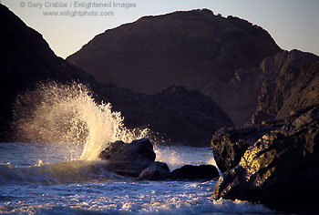 Wave crashing on rocks at sunset on the southern Oregon coast, near Gold Beach, Oregon