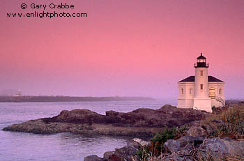 Pre-dawn glow at sunrise over the Coquille River Lighthouse, Bullards Beach State Park, Bandon, Southern Oregon Coast