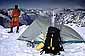 Cross country skier's winter tent camp overlooking snow covered mountains, above Yosemite Valley, Yosemite National Park, California