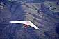 Hang glider in spring over oak covered hills, Mount Diablo State Park, Contra Costa County, California