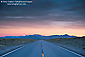 Storm clouds at sunrise over desert highway near Wells, Nevada