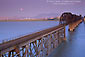 Image: Evening moonrise over railroad bridge over the Carquinez Strait, California