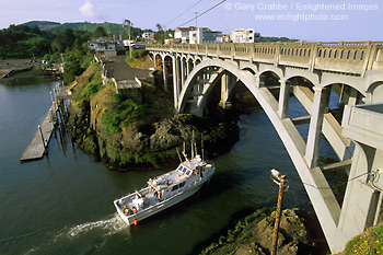 Picture: Boat passing under arch bridge at Depot Bay, Central Oregon Coast