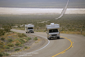 Image: Pair of Recreational Vehicle (RV's) Campers on curving desert highway, near Death Valley, California