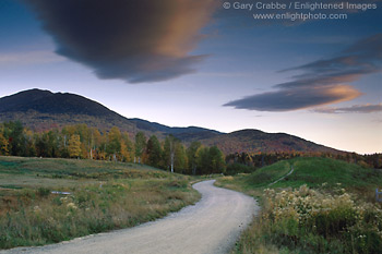 Image: Dirt road curves through field at sunrise, White Mountains, New Hampshire