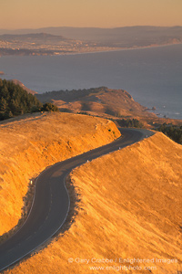 Photo: Sunset light on twisting two lane mountain road above the Pacific Ocean, Mount Tamalpais, Marin County, California