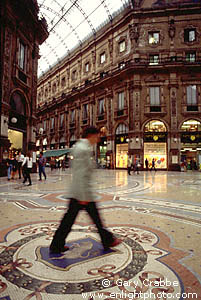 Tourist stepping on the Bull, Piazza di Duomo, Milan, Italy