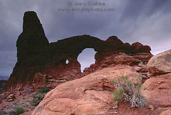 Evening storm clouds over Turret Arch, Arches National Park, Utah