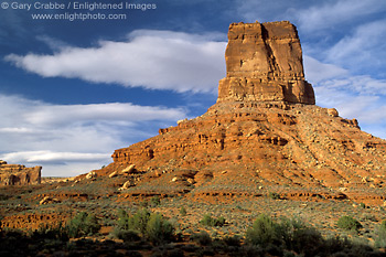Photo: Blue sky and clouds over eroded red rock sandstone butte tower, Valley of the Gods, Utah