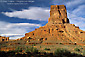Photo: Blue sky and clouds over eroded red rock sandstone butte tower, Valley of the Gods, Utah