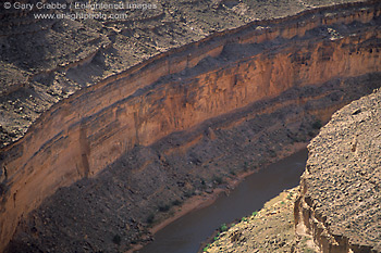 Photo: Sheer eroded rock canyon wall along the San Juan River, Goosenecks State Park, Utah