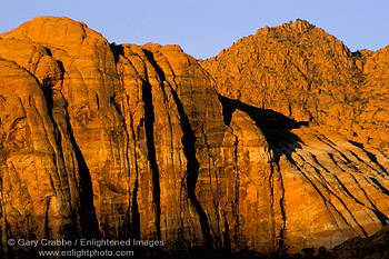 Image: First light on red sandstone cliffs, Snow Canyon State Park, near St. George, Utah's Dixie, Utah