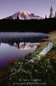 Mount Rainier (volcano) reflected in alpine lake at sunrise, Mount Rainier National Park, Washington