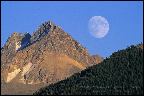Moon rising over mountain, Grand Teton National Park, Wyoming