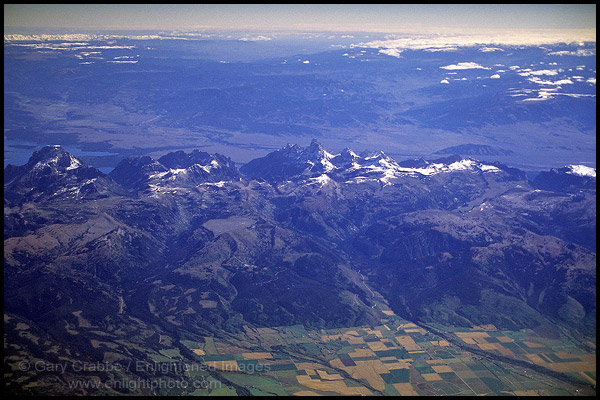 Aerial over uplifted Tetons Mountain range and Driggs Valley