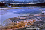 Picture: Mineral deposits at edge of thermal hot spring at sunset, Biscuit Basin, Yellowstone National Park, WYOMING
