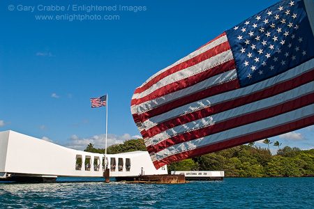 The US Flag flying above the USS Arizona Memorial at Pearl Harbor, Oahu, Hawaii