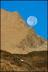 Photo: Full moon resting on rock precipice near Tioga Pass, Mono County, California