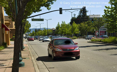 Car driving on suburban street in downtown Pleasant Hill, California