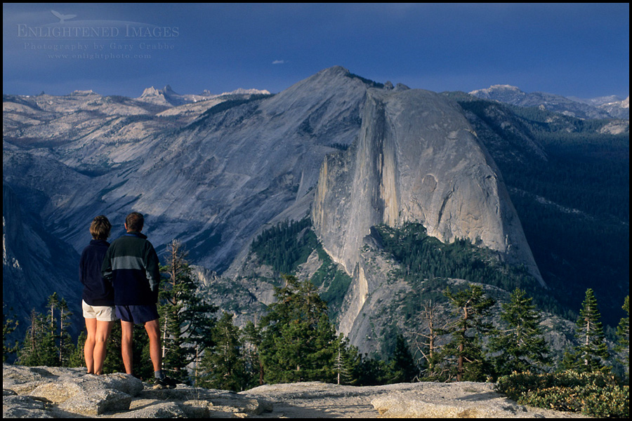 Image: Hikers looking towards Half Dome and Tenaya Canyon from atop Sentinel Dome, Yosemite National Park, California 