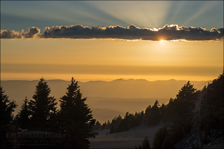 Image: Sunset and god beams from the rim of Crater Lake, Crater Lake National Park, Oregon