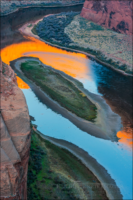 Image: Photographers standing on the rim of Horseshoe Bend at dawn over the Colorado River, near Page, Arizona