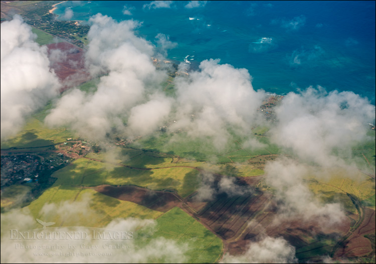 Image: Aerial view of clouds and sugar cane fields over south central Maui while on approach to Kahalui Airport, Maui, Hawaii