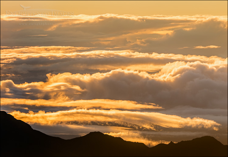 Image: Sunrise light on clouds as seen from the summit of Haleakala National Park, Maui, Hawaii