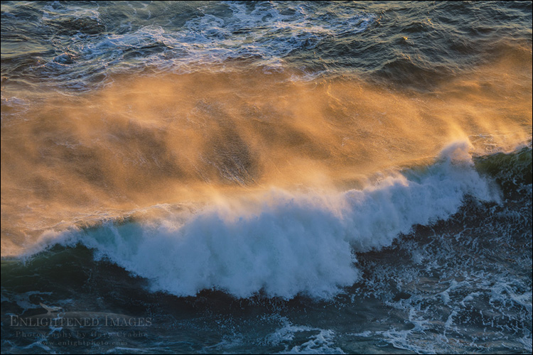 Image: Sunset light illuminates the spray off a breaking wave along the coast at Point Reyes National Seashore, Marin County, California