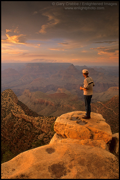 Photo: Tourist on the edge of the canyon rim at sunset, Grandview Point, Grand Canyon National Park, Arizona
