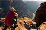 Picture: Tourist taking pictures over the Colorado River at the edge of Toroweap Overlook, near Tuweep, North Rim, Grand Canyon National Park, Arizona
