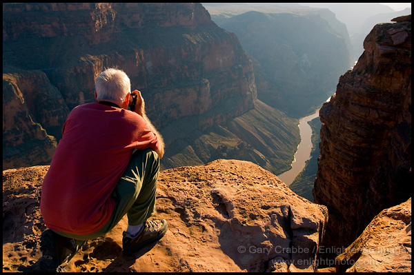 Photo: Tourist taking pictures over the Colorado River at the edge of Toroweap Overlook, near Tuweep, North Rim, Grand Canyon National Park, Arizona