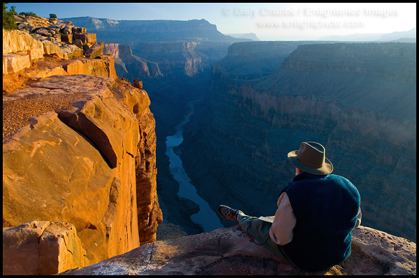 Photo: Tourist enjoying the view over the Colorado River from Toroweap Overlook, North Rim, Grand Canyon National Park, Arizona