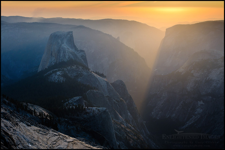 Picture: Sunset light streaming through Yosemite Valley toward Half Dome, as seen from atop Clouds Rest, Yosemite National Park, California