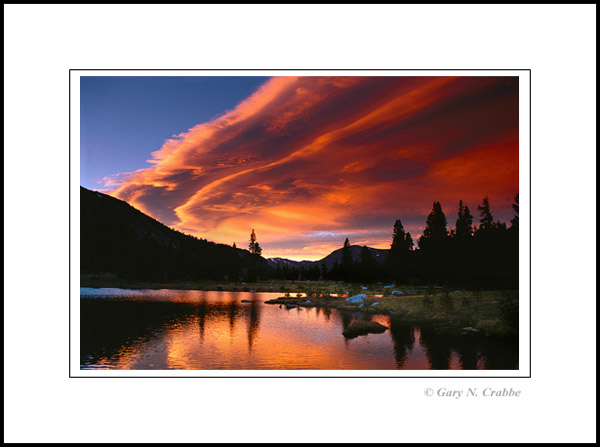 Photo: Sunset light on lenticular cloud over alpine tarn at Tioga Pass, Yosemite National Park, California